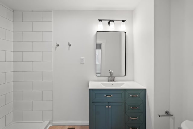 904 5th Ave, Dayton, KY 41074 - full bathroom with vanity, wood finished floors, toilet, and a shower