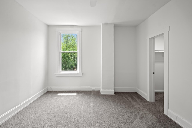 904 5th Ave, Dayton, KY 41074 - unfurnished bedroom featuring carpet floors, a spacious closet, baseboards, a closet, and ceiling fan