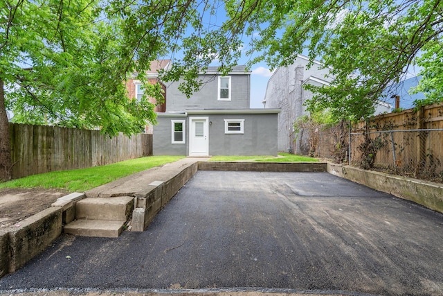 904 5th Ave, Dayton, KY 41074 - rear view of property featuring stucco siding and a patio area