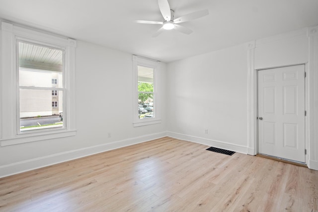 904 5th Ave, Dayton, KY 41074 - spare room with wood finished floors, a ceiling fan, and baseboards
