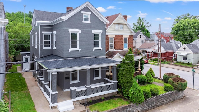 904 5th Ave, Dayton, KY 41074 - view of front of house with brick siding, a porch, a chimney, and roof with shingles