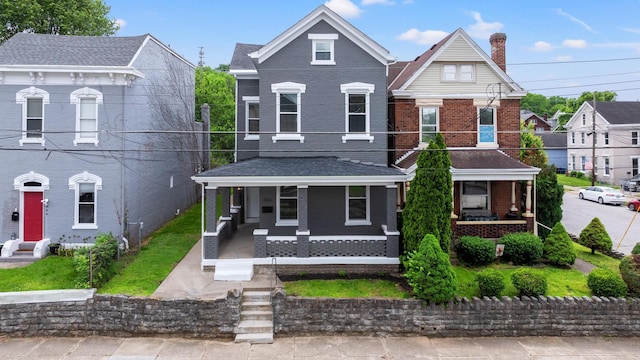 904 5th Ave, Dayton, KY 41074 - view of front of property with a porch, brick siding, and a chimney