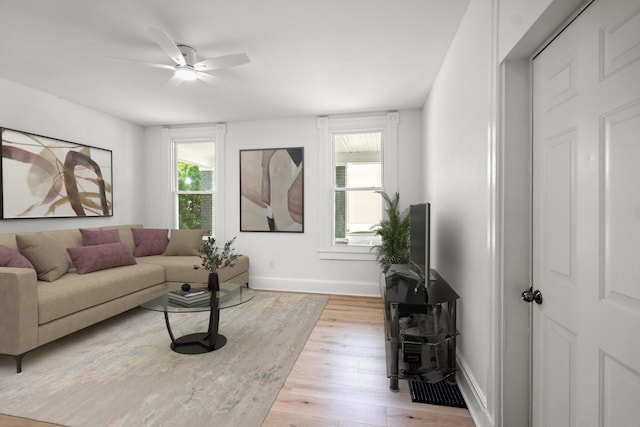 904 5th Ave, Dayton, KY 41074 - living area with baseboards, light wood-style floors, and ceiling fan