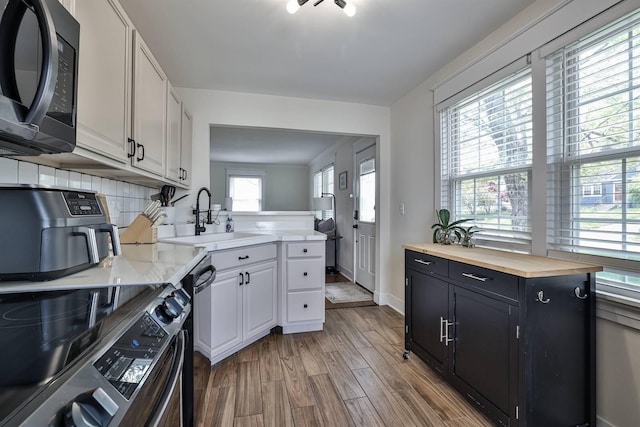 406 Hallam Ave, Erlanger, KY 41018 - kitchen with range, a sink, wood counters, dark cabinets, and wood finished floors