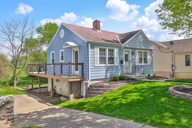 406 Hallam Ave, Erlanger, KY 41018 - view of front of property featuring a chimney, a front yard, and a deck