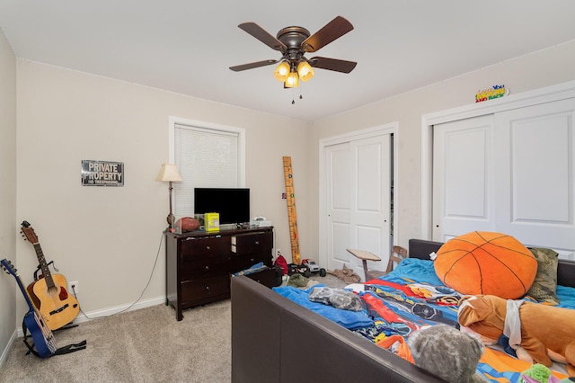 1500 Heathen Ridge Rd, Crittenden, KY 41030 - bedroom featuring light colored carpet, baseboards, multiple closets, and a ceiling fan