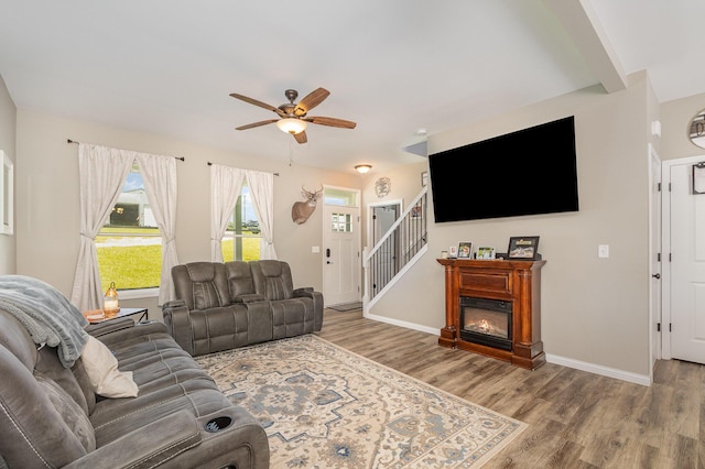 1500 Heathen Ridge Rd, Crittenden, KY 41030 - living room featuring wood finished floors, a ceiling fan, stairs, and baseboards