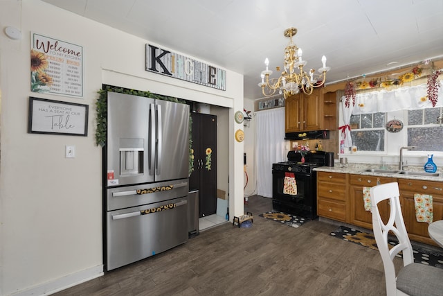 29 Locust St, Walton, KY 41094 - kitchen with stainless steel fridge, a sink, gas stove, brown cabinets, and dark wood-style floors