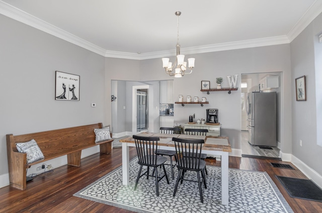 259 Van Voast Ave Unit 1, Bellevue, KY 41073 - dining space with crown molding, a chandelier, wood finished floors, and baseboards