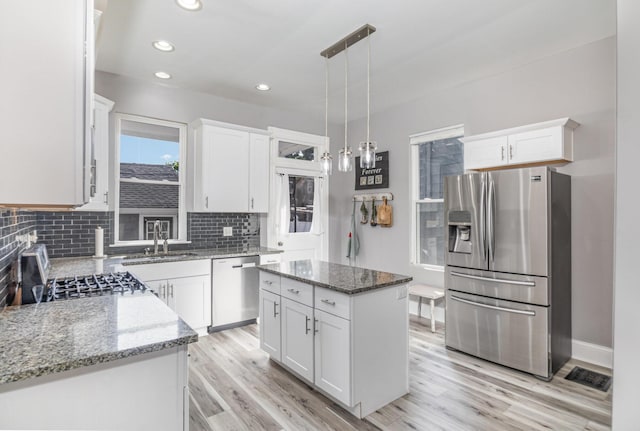 259 Van Voast Ave Unit 1, Bellevue, KY 41073 - kitchen with stainless steel appliances, a sink, light wood-style flooring, white cabinetry, and recessed lighting