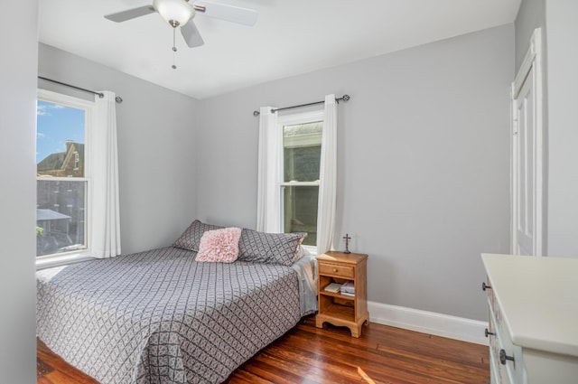 259 Van Voast Ave Unit 1, Bellevue, KY 41073 - bedroom featuring wood finished floors, multiple windows, baseboards, and a ceiling fan