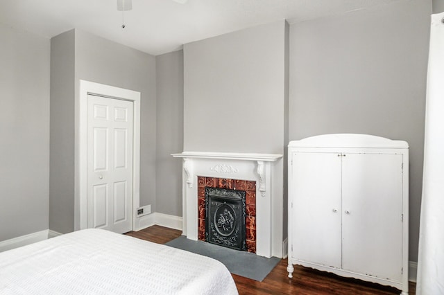 259 Van Voast Ave Unit 1, Bellevue, KY 41073 - bedroom featuring dark wood-type flooring, a fireplace with flush hearth, and baseboards