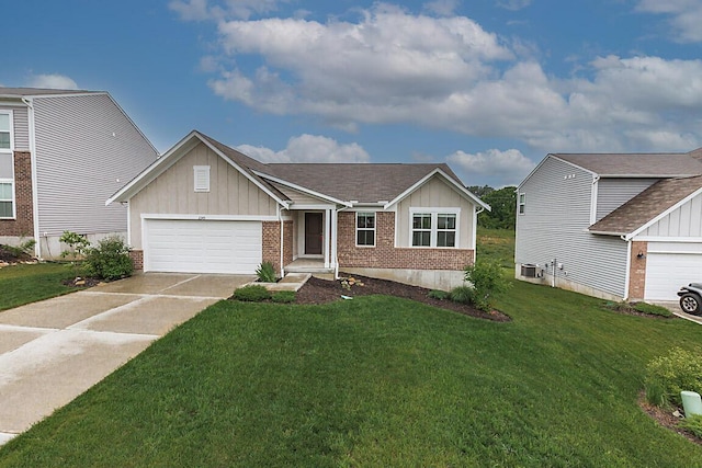 2345 John James Ct, Hebron, KY 41048 - view of front of property featuring board and batten siding, an attached garage, brick siding, driveway, and a front lawn