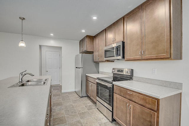 2345 John James Ct, Hebron, KY 41048 - kitchen featuring stainless steel appliances, a sink, light countertops, hanging light fixtures, and recessed lighting