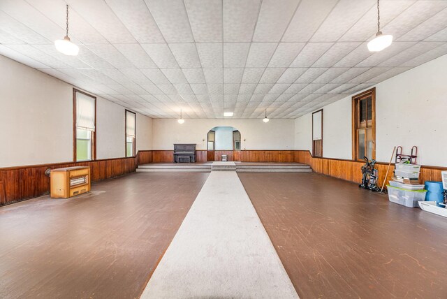 5489 Bridgeville Rd, Brooksville, KY 41004 - miscellaneous room featuring wainscoting, wooden walls, wood finished floors, and a wood stove