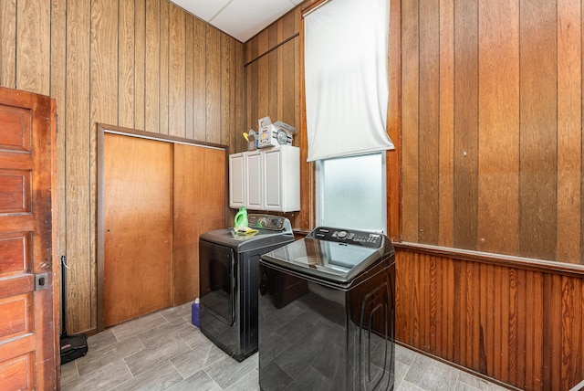 5489 Bridgeville Rd, Brooksville, KY 41004 - washroom featuring cabinet space, wooden walls, and washing machine and clothes dryer