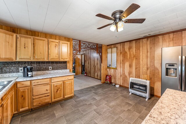 5489 Bridgeville Rd, Brooksville, KY 41004 - kitchen featuring stainless steel fridge with ice dispenser, heating unit, wood walls, a ceiling fan, and backsplash