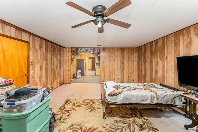 5489 Bridgeville Rd, Brooksville, KY 41004 - bedroom with light colored carpet, wood walls, and a ceiling fan