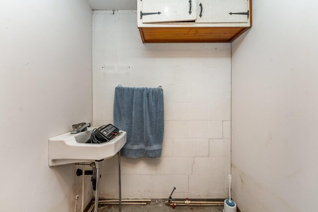 5489 Bridgeville Rd, Brooksville, KY 41004 - bathroom with concrete block wall and a sink