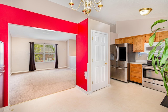 876 Virginiabradford Ct, Erlanger, KY 41018 - kitchen featuring stainless steel appliances, a chandelier, brown cabinets, and light countertops