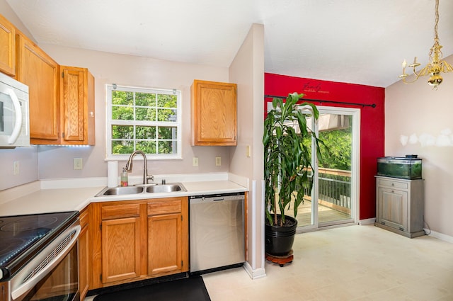 876 Virginiabradford Ct, Erlanger, KY 41018 - kitchen featuring appliances with stainless steel finishes, a sink, light countertops, a chandelier, and decorative light fixtures
