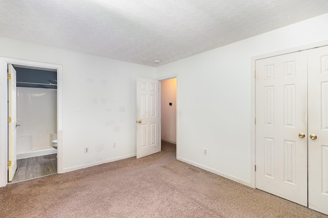 876 Virginiabradford Ct, Erlanger, KY 41018 - unfurnished bedroom with carpet floors, baseboards, a textured ceiling, and a closet