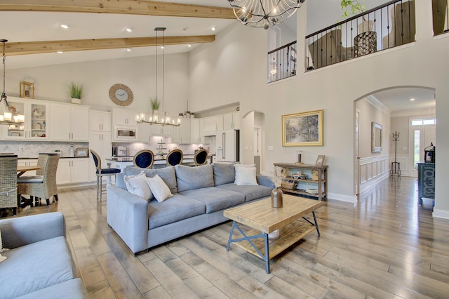 827 Iva Del Ct, Crescent Springs, KY 41017 - living room featuring a chandelier, arched walkways, light wood-type flooring, recessed lighting, and high vaulted ceiling