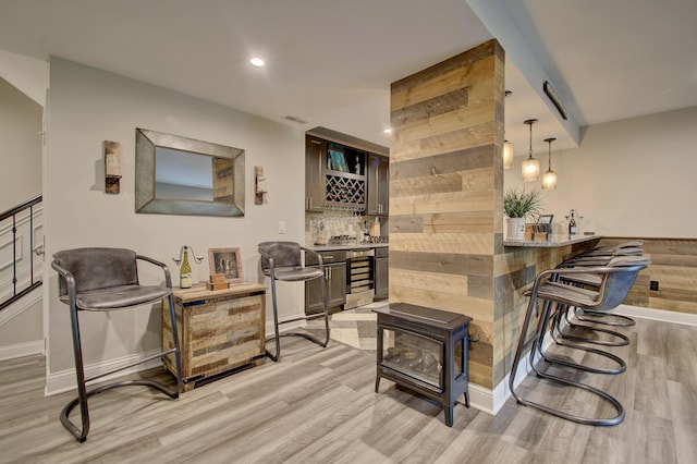 827 Iva Del Ct, Crescent Springs, KY 41017 - indoor bar featuring beverage cooler, light wood finished floors, baseboards, tasteful backsplash, and recessed lighting