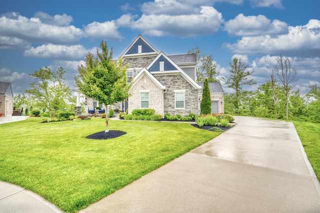 827 Iva Del Ct, Crescent Springs, KY 41017 - view of front of house featuring stone siding, driveway, a front yard, and a garage