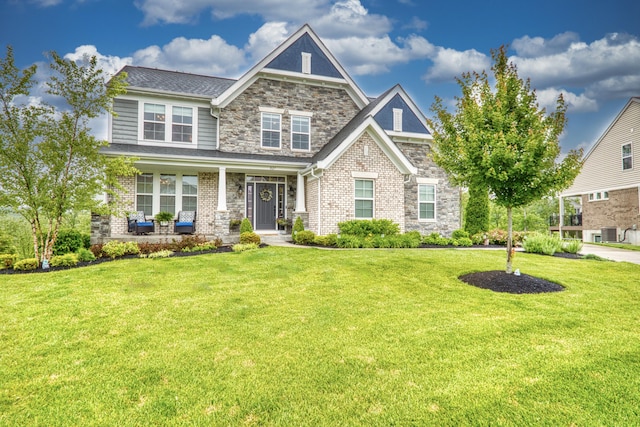 827 Iva Del Ct, Crescent Springs, KY 41017 - craftsman house with a front lawn, a porch, stone siding, and brick siding