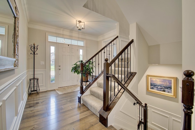 827 Iva Del Ct, Crescent Springs, KY 41017 - foyer with a decorative wall, hardwood / wood-style flooring, stairs, ornamental molding, and a wainscoted wall