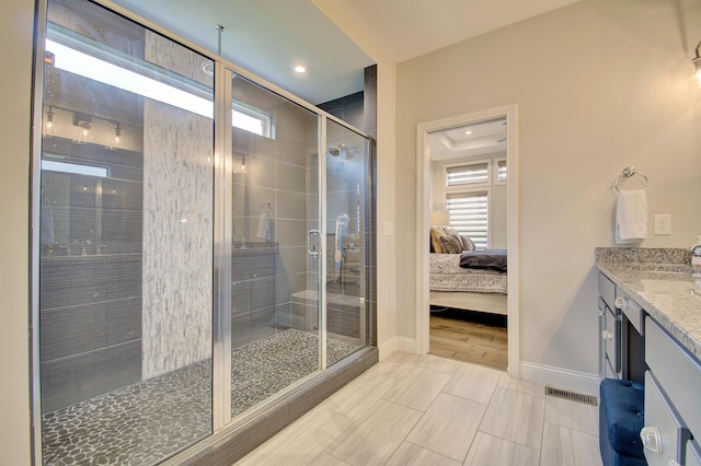 827 Iva Del Ct, Crescent Springs, KY 41017 - ensuite bathroom featuring healthy amount of natural light, a shower stall, vanity, baseboards, and recessed lighting