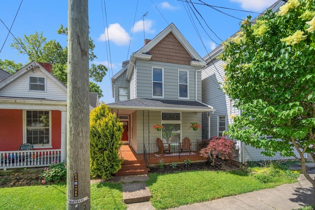 203 E Southern Ave, Covington, KY 41015 - view of front of home featuring a porch and a front lawn