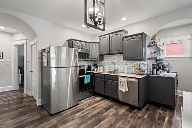 203 E Southern Ave, Covington, KY 41015 - kitchen with stainless steel appliances, gray cabinetry, arched walkways, a sink, and recessed lighting