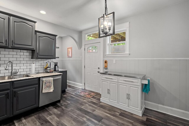 203 E Southern Ave, Covington, KY 41015 - kitchen featuring dishwasher, a sink, arched walkways, tasteful backsplash, and light countertops