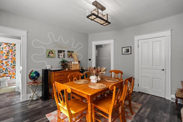 203 E Southern Ave, Covington, KY 41015 - dining room featuring dark wood-style floors and baseboards