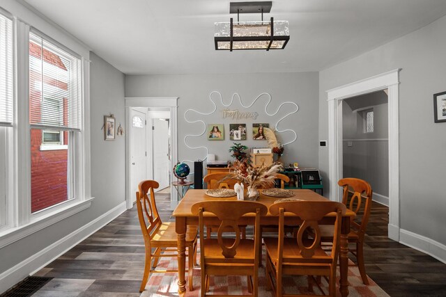 203 E Southern Ave, Covington, KY 41015 - dining space featuring healthy amount of natural light, dark wood-style flooring, and baseboards