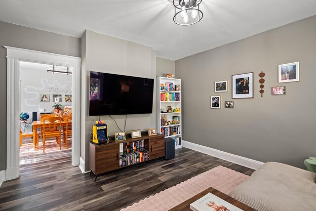 203 E Southern Ave, Covington, KY 41015 - living room with dark wood-style flooring, baseboards, and a chandelier