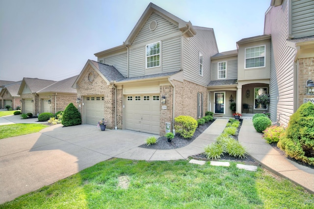 208 Misty Cove Way, Highland Heights, KY 41076 - multi unit property with brick siding, driveway, a shingled roof, and a garage