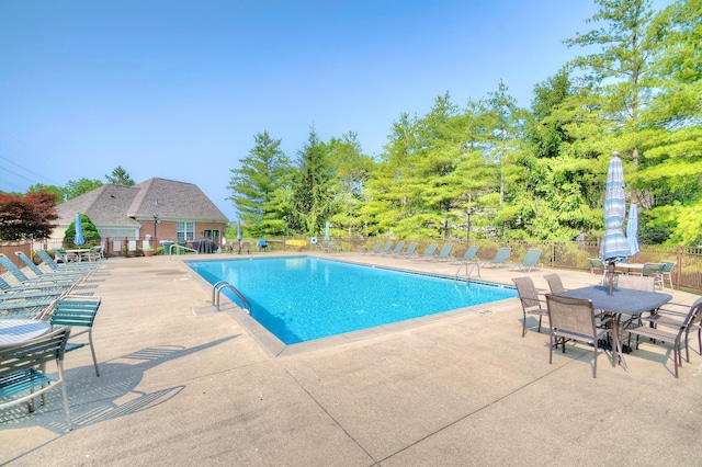 208 Misty Cove Way, Highland Heights, KY 41076 - community pool featuring a patio area and view of wooded area