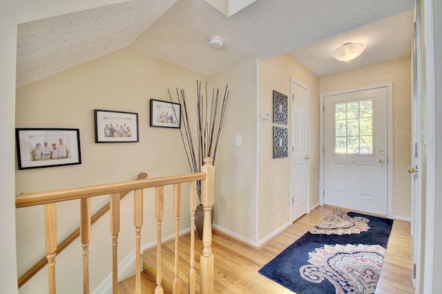 208 Misty Cove Way, Highland Heights, KY 41076 - foyer entrance featuring wood finished floors, a textured ceiling, and vaulted ceiling