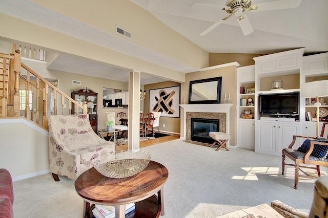 208 Misty Cove Way, Highland Heights, KY 41076 - living room featuring lofted ceiling, light colored carpet, ceiling fan, stairway, and a high end fireplace