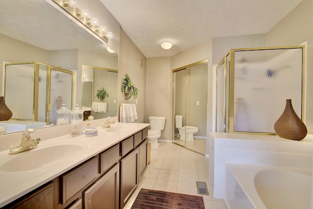208 Misty Cove Way, Highland Heights, KY 41076 - bathroom with a shower stall, double vanity, a garden tub, tile patterned floors, and a textured ceiling