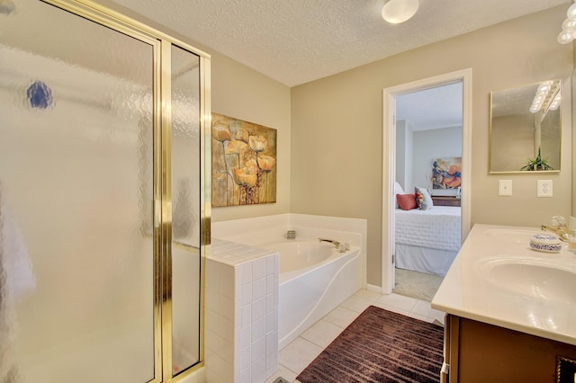 208 Misty Cove Way, Highland Heights, KY 41076 - ensuite bathroom featuring a garden tub, double vanity, tile patterned flooring, a stall shower, and a textured ceiling