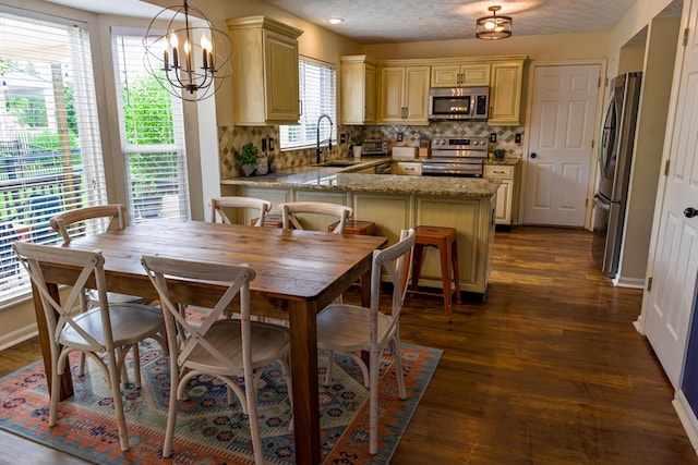 1496 Skye Dr, Independence, KY 41051 - dining area with dark wood-type flooring, a chandelier, and baseboards