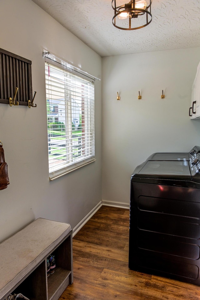1496 Skye Dr, Independence, KY 41051 - laundry room featuring cabinet space, washing machine and dryer, dark wood-style flooring, baseboards, and a textured ceiling