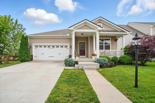 1344 Wilshire Ct, Union, KY 41091 - view of front facade with a garage, a porch, a front yard, and concrete driveway