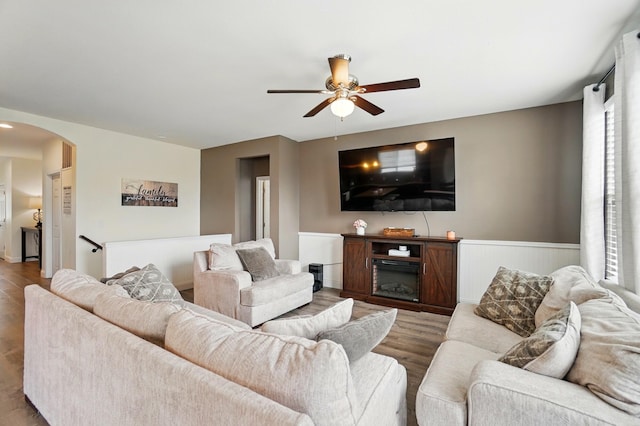 1344 Wilshire Ct, Union, KY 41091 - living room featuring ceiling fan, arched walkways, wood finished floors, and wainscoting