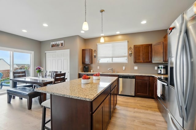 1344 Wilshire Ct, Union, KY 41091 - kitchen with appliances with stainless steel finishes, a sink, recessed lighting, a center island, and hanging light fixtures