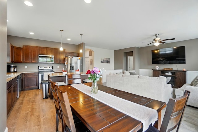 1344 Wilshire Ct, Union, KY 41091 - dining room with arched walkways, light wood-style flooring, ceiling fan, and recessed lighting